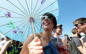 A festival-goer at Laneway enjoys the sun in Auckland on 26 January 2015.