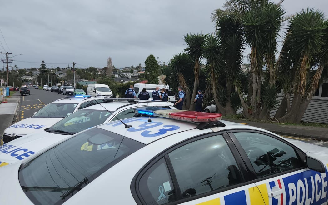 Police on Bardia Street in Belmont, Auckland.