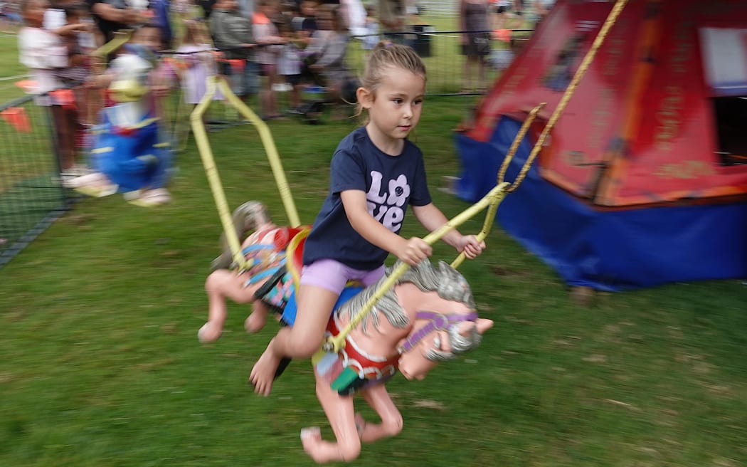 The free rides, including the merry-go-round, proved popular with the kids.