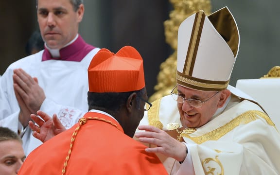 Cardinal Kelvin Edward Felix receives his beret as he is appointed cardinal by Pope Francis in Rome.