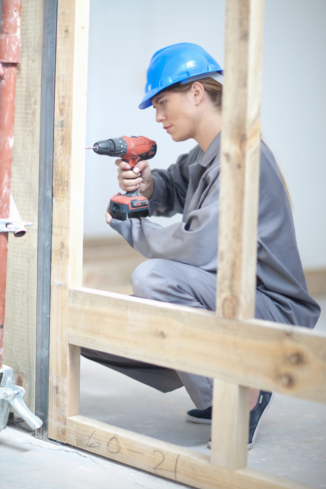 Woman working on construction site.