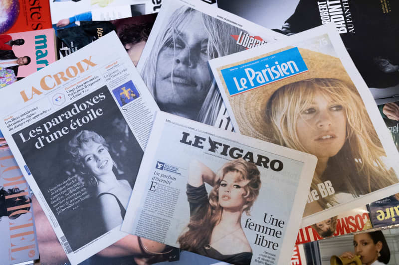 Illustration of a montage of French newspapers La Croix, Le Figaro, Liberation and Le Parisien, whose front page pays tribute to the former French actress and animal rights activist Brigitte Bardot following her death the previous day in a newsagent's in Paris, France, on December 29, 2025.
