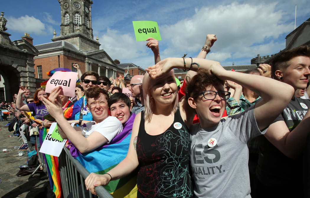 Supporters for same-sex marriage raise a cheer at Dublin Castle as they wait for the result.
