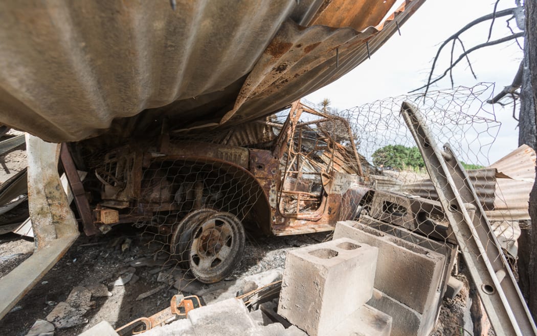 A burnt out vehicle at the property on Worsley’s Road.