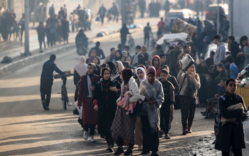 EDITORS NOTE: Graphic content / Palestinians walk toward safer areas following the resumption of Israeli strikes on Rafah in the southern Gaza Strip on December 1, 2023, after the expiration of a seven-day truce between Israel and Hamas militants. A temporary truce between Israel and Hamas expired on December 1, with the Israeli army saying combat operations had resumed, accusing Hamas of violating the operational pause. (Photo by MAHMUD HAMS / AFP)