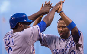 Lorenzo Cain celebrates with Kansas City Royals shortstop Alcides Escobar.