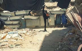 Image of Ahmad dancing among ruins in Damascus