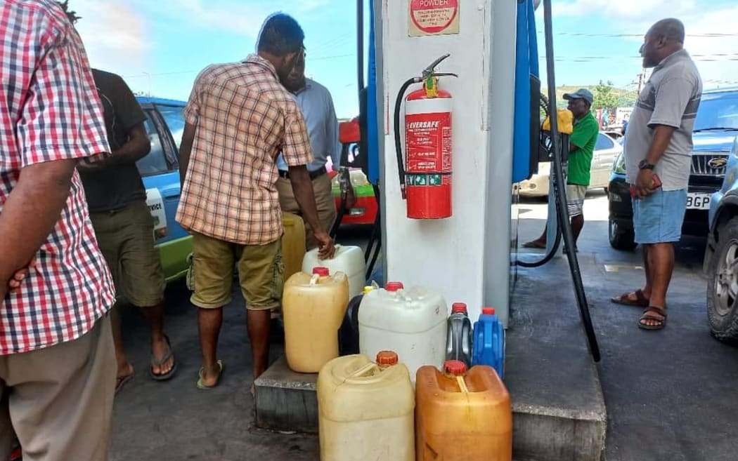People line up at Puma energy service stations to get fuel. February 2023.