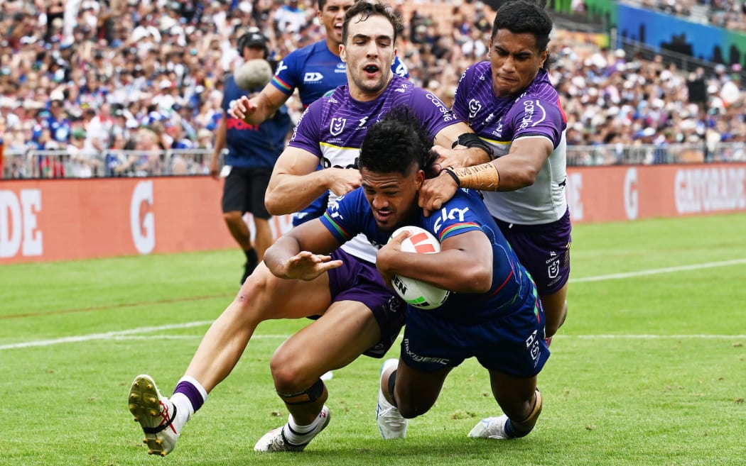 Ali Leiataua of the Warriors scores against Melbourne Storm.
