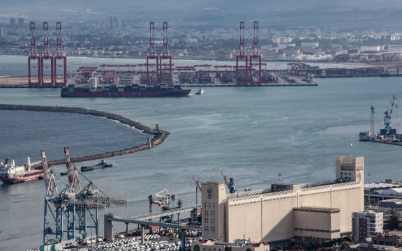 Cargo ships are seen at Israel's Haifa commercial shipping port in the Mediterranean Sea on December 13, 2023. In solidarity with Palestinians in Gaza, Yemen's Houthis are warning that they will target cargo vessels sailing through the Red Sea if they are heading for Israeli ports, regardless of their nationality. (Photo by Mati Milstein/NurPhoto) (Photo by Mati Milstein / NurPhoto / NurPhoto via AFP)