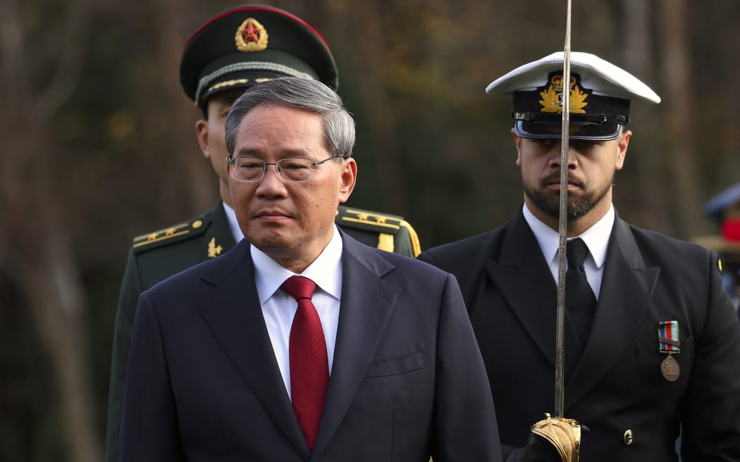 WELLINGTON, NEW ZEALAND - JUNE 13: Premier of the People’s Republic of China, Li Qiang, inspects the guard during an official welcome at Government House on June 13, 2024 in Wellington, New Zealand. Li is in New Zealand for a three-day official visit. China is New Zealand's largest trading partner for trade in goods, both in terms of imports and exports. In 2022, bilateral trade reached almost US$25.2 billion, with Chinese exports to New Zealand valued at US$9.2 billion and imports from New Zealand valued at almost US$16 billion. (Photo by Hagen Hopkins - Pool/Getty Images)