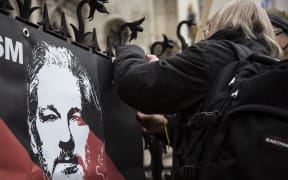 Supporters of Julian Assange stage a demonstration in front of Supreme Court in London on 24 January 2022.