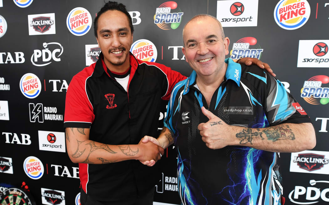NZ's Darren Herewini aka Apocalypse and Phil " the power" Taylor match up in the first round of Auckland Darts Masters Thursday 10 August 2017.