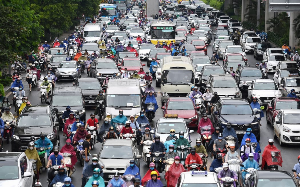 Motorists in morning rush hour traffic in Hanoi on 12 May.