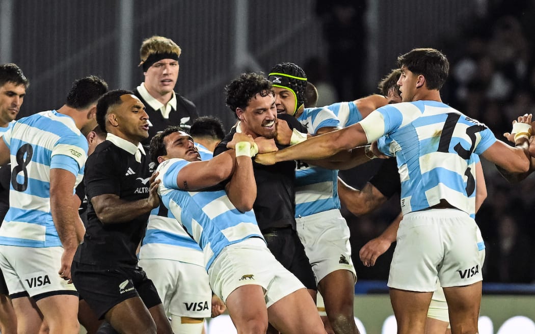 Billy Proctor involved in a tussle with Argentina Los Pumas players.