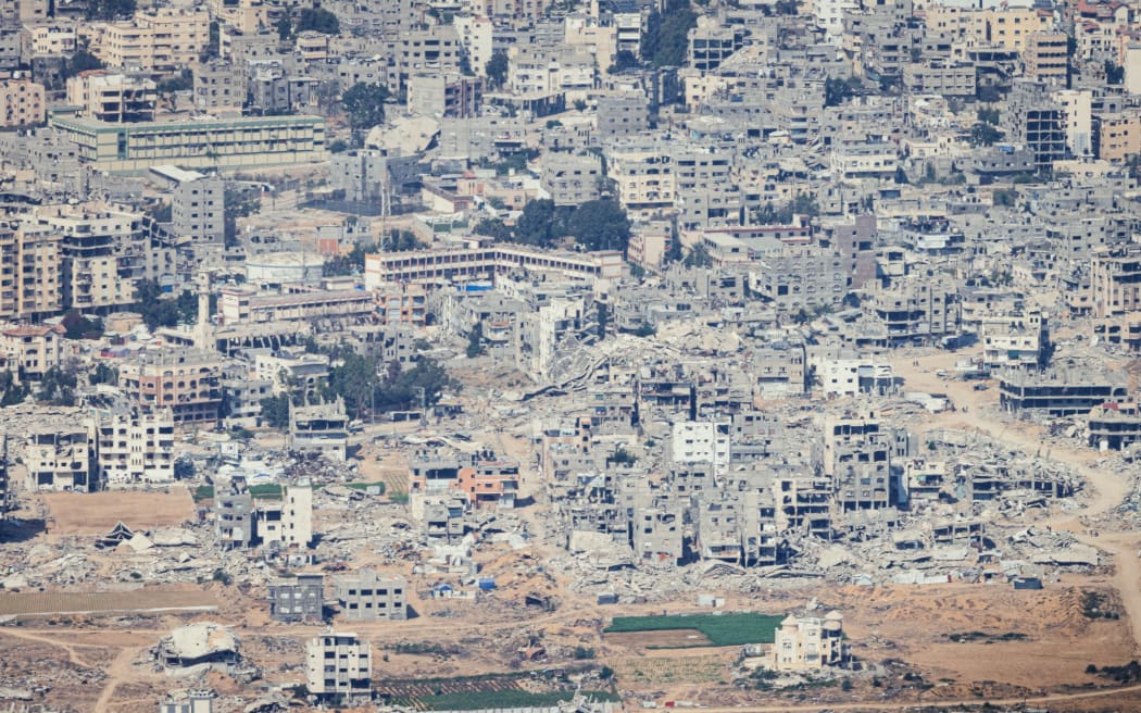 A view of the destruction ind the Gaza Strip, from a Jordanian military aircraft before the airdrop operation of aid over Gaza on 14 August, 2025.