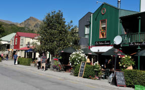 ARROWTOWN, NZ - FEB 10: Visitors in Arrowtown on February 10 2009. Arrowtown is a historic gold mining town in the Otago region of the South Island of New Zealand.