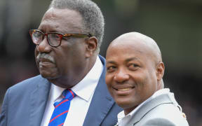 Former West Indies cricketers Clive Lloyd (L) and Brian Lara pose ahead of the start of the 2019 Cricket World Cup final between England and New Zealand at Lord's Cricket Ground in London on July 14, 2019. (Photo by Dibyangshu Sarkar / AFP) / RESTRICTED TO EDITORIAL USE