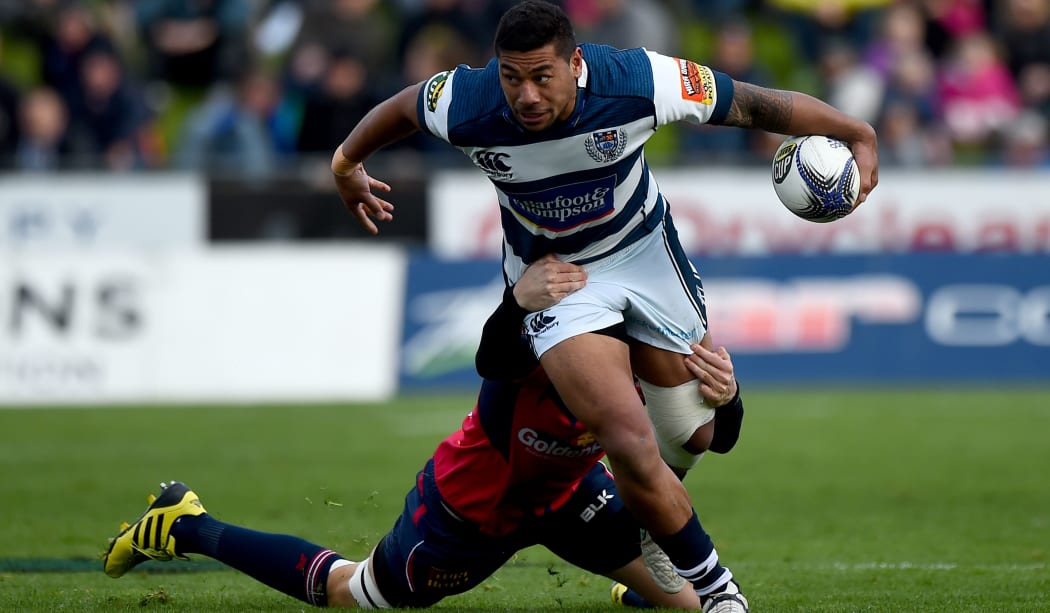 Auckland's Charles Piutau is tackled by a Tasman player, 2015.