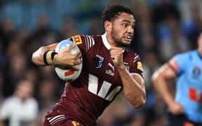 Xavier Coates of the Maroons runs with the ball during Game 1 of the State of Origin 2024 between the Queensland Maroons and the New South Wales Blues in Sydney.