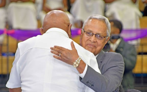 Sitiveni Rabuka and Mahnedra Chaudhry embrace at the reconciliation church service on 14 May 2023.