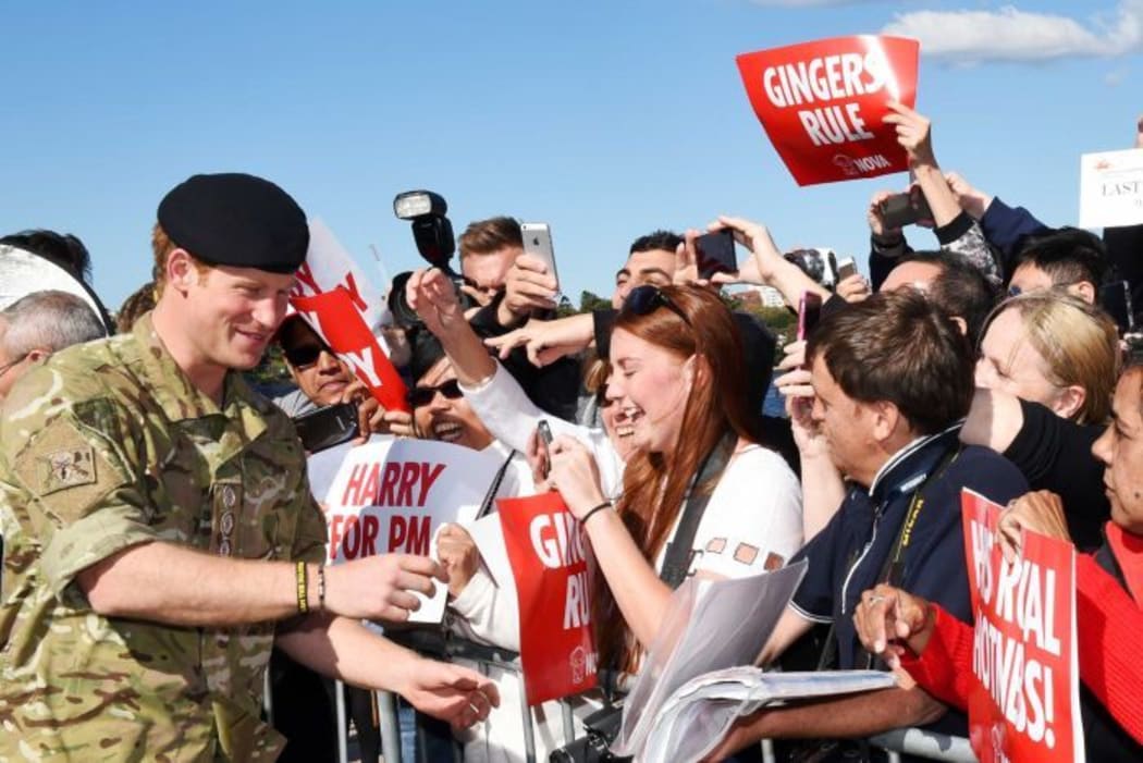 Prince Harry meets members of the public on his last official engagement before leaving Australia.