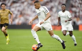 Kylian Mbappé of Real Madrid controls the ball during the La Liga EA Sports match between Real Madrid CF and Real Sociedad de Fútbol at Santiago Bernabéu on May 24, 2025 in Madrid, Spain. (Photo by Gokhan Taner / Middle East Images / Middle East Images via AFP)