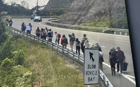 People get off and make their own way up Remutaka Hill after a  bus replacement for a train service broke down.