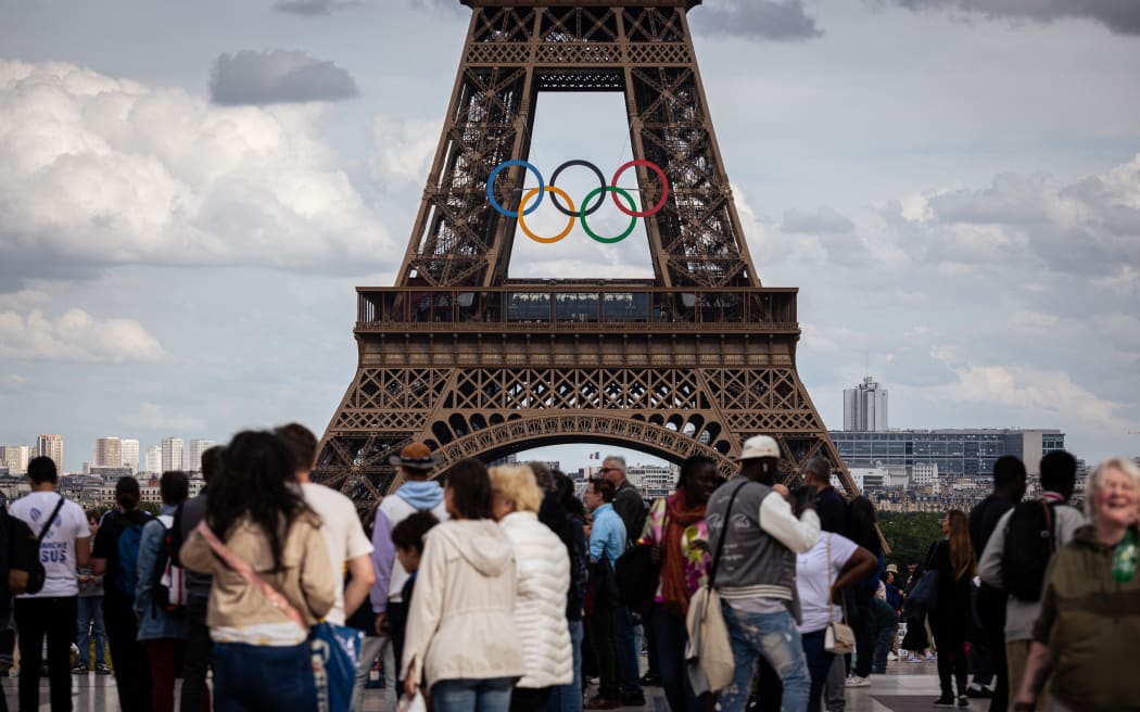 Giant rings are being installed on the Eiffel Tower in Paris, France, on June 14, 2024, before the opening of the Olympic Games.
