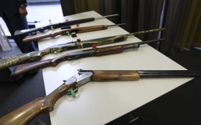 Firearms that will remain legal, depending on number of rounds and magazine type, on display at the police press conference.