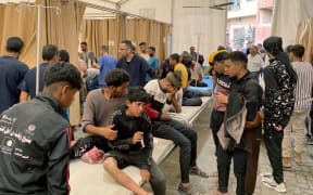Palestinians who were injured in Israeli fire as they gathered near a food aid centre, receive care at Khan Younis' Nasser hospital in the southern Gaza Strip on 17 June, 2025. Gaza's civil defence agency said Israeli forces killed at least 47 people and wounded more than 200, as thousands of Palestinians gathered to receive flour at an aid centre in the morning, adding "Israeli drones fired at the citizens... some minutes later, Israeli tanks fired several shells at the citizens, which led to a large number of martyrs and wounded".