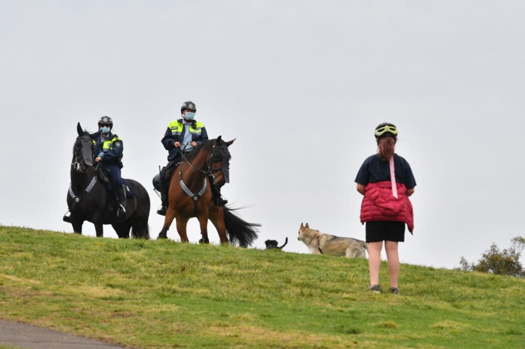 Police on horseback patrol Sydney Park on September 18, 2021, following calls for an anti-lockdown protest rally amid the coronavirus pandemic.