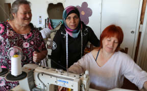 Sewing Tutor Linda (left), Sew Good mama Safaa and tutor Sally Gray at The Remakery, Wellington