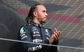 Mercedes driver Lewis Hamilton of Great Britain take third place on the podium