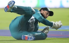 New Zealand's Devon Conway takes a catch to dismiss West Indies' Nicholas Pooran.