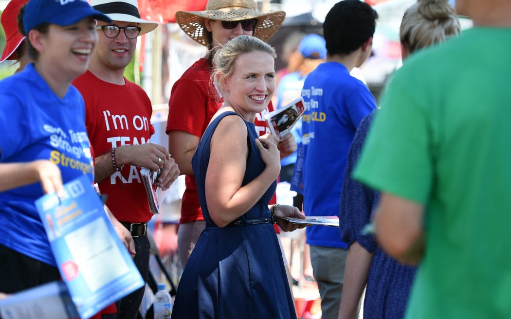 Kate Jones, Labor's candidate for the Queensland State seat of Ashgrove, greets voters outside a polling booth in Brisbane.