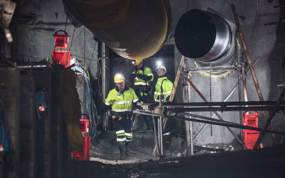 Geotechnical engineer Chris Lee, Mine Deputy Kirk Neilson and Chief Operating Officer Dinghy Pattinson opening the doors to the mine.