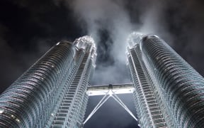 The Petronas Twin Towers are seen at night in Kuala Lumpur November 20, 2015. The Malaysian city hosts the 27th Association of South East Asian Nations (ASEAN) Summit