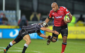 Nemani Nadolo fends off Paul Jordaan during the Crusaders' loss to the Sharks in May 2014