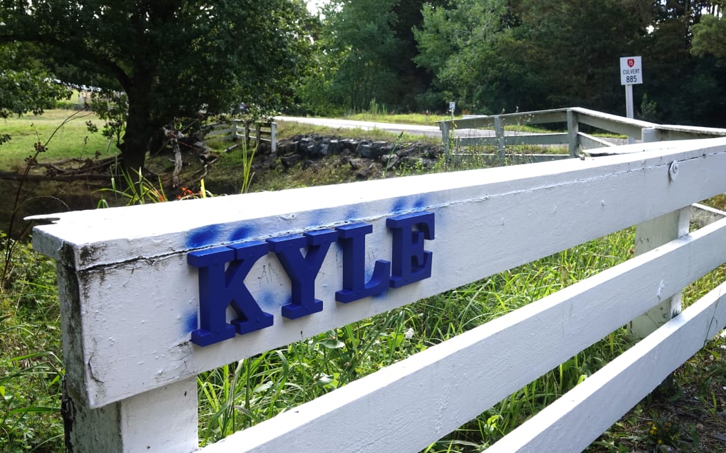 Friends of 18-year-old Kyle Jenkins have left a tribute at the layby on Otaika Valley Road, Whangārei, where police say he was killed on the evening of 28 January 2025.