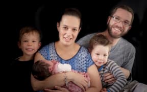 Carterton man Nick Perkins, who has recovered from MS after travelling to Singapore for treatment, with his family.