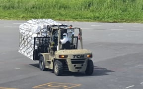 Medical and humanitarian aid sent by Australia's Air Force to Vanuatu being offloaded at Bauerfield Airport.