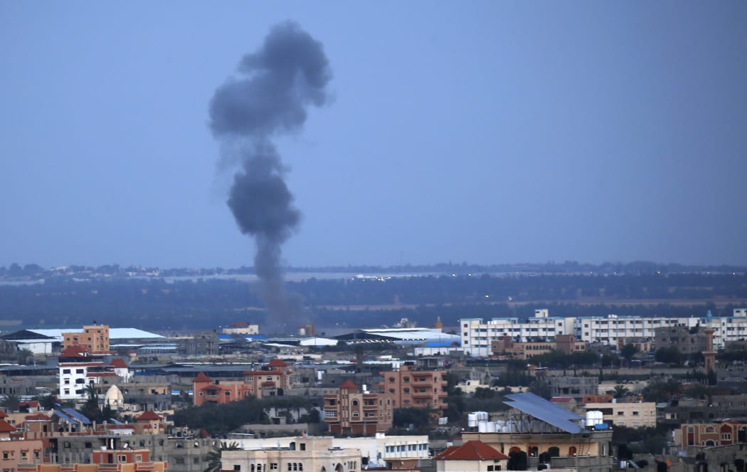 Smoke rises above buildings in Rafah, in the southern Gaza Strip. Israel's military launched strikes on Hamas targets in Gaza, the army and witnesses said, hours after a rocket from the Palestinian enclave hit a house and wounded seven Israelis.