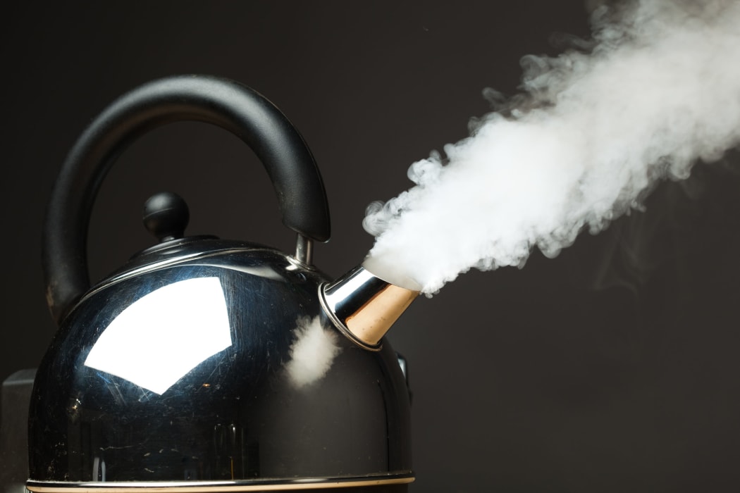 boiling kettle with dense steam