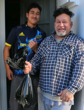 Lamu and his son, more happy customers.