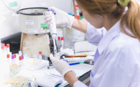 Asia women medical technology doing research in laboratory hospital