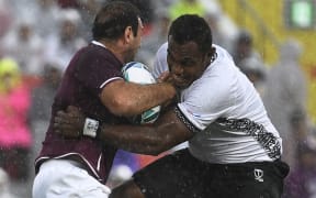 Fiji's lock Leone Nakarawa (R) tackles Georgia's flanker Mamuka Gorgodze during the RugbY World Cup pool match..