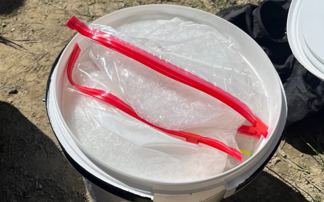 A bucket containing methamphetamine, located by police during a search warrant carried out as part of Operation Gallium.