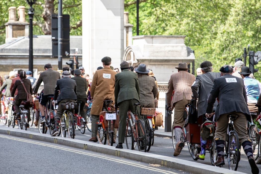 LONDON, UK - May 4, 2019. London Tweed Run. People with old bicycles and clothes