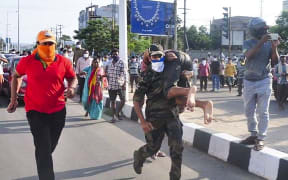 Rescuers evacuate people following a gas leak incident at an LG Polymers plant in Visakhapatnam on May 7, 2020.